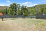 Enjoy the ultimate outdoor experience with this stunning tennis court.