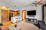 Step into this inviting living space, featuring a cozy fireplace and a modern entertainment setup.