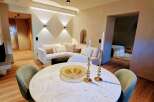 Experience luxury living in this stunning property, featuring a beautifully designed dining area.