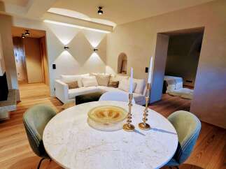 Experience luxury living in this stunning property, featuring a beautifully designed dining area.