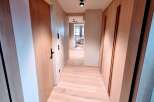 Step into a world of modern elegance with this stunning hallway.
