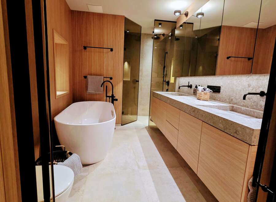 Step into luxury with this stunning bathroom featuring a sleek, modern design.