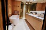 Step into luxury with this stunning bathroom featuring a sleek, modern design.