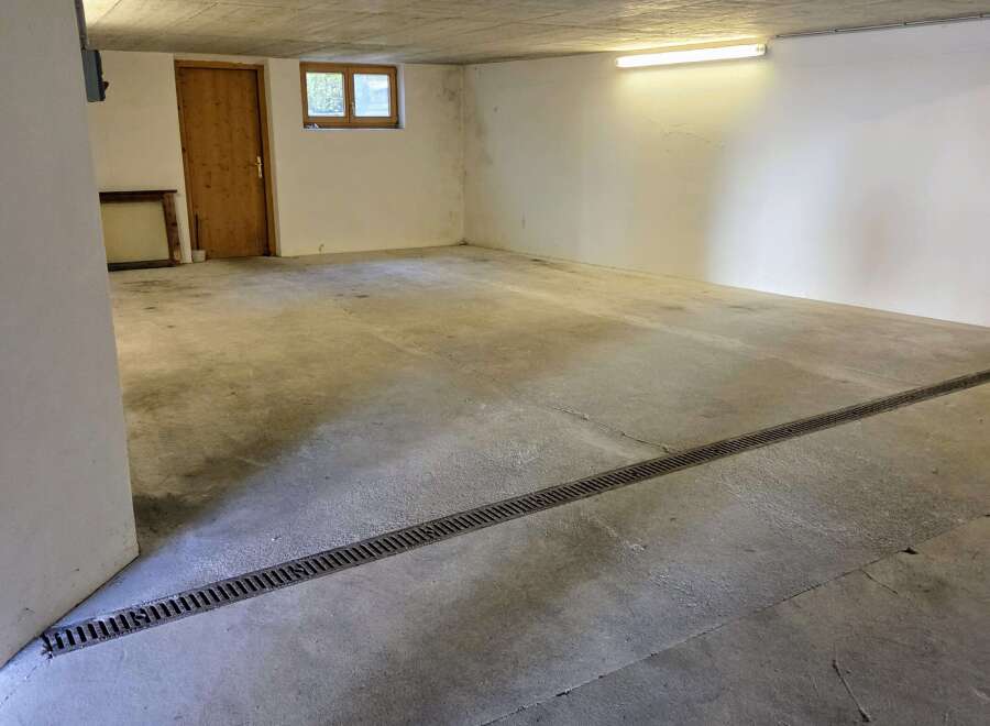 Discover the potential of this spacious, empty garage, perfect for storage or parking.
