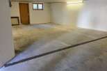 Discover the potential of this spacious, empty garage, perfect for storage or parking.