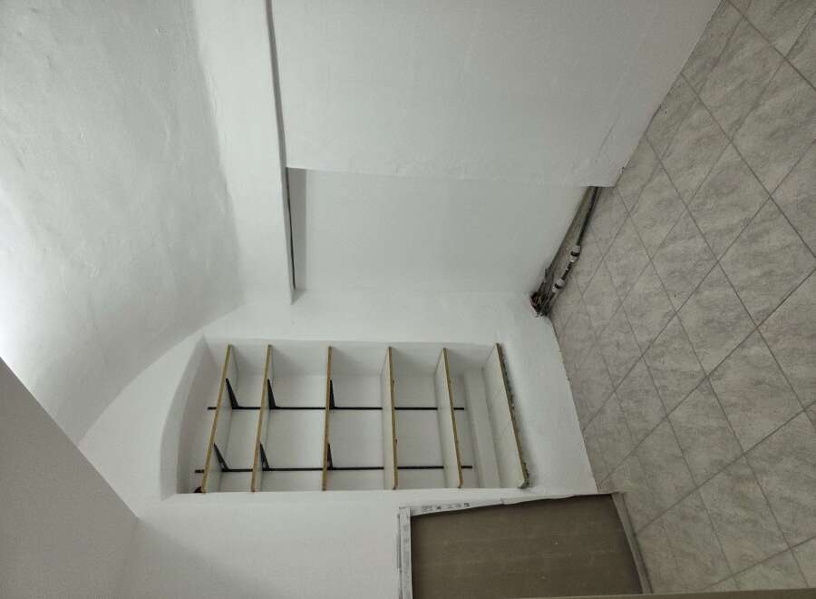 This unique property features a custom-built storage unit, perfect for maximizing space and organization.