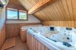 Indulge in luxury and relaxation in this stunning property featuring a spa-like retreat.
