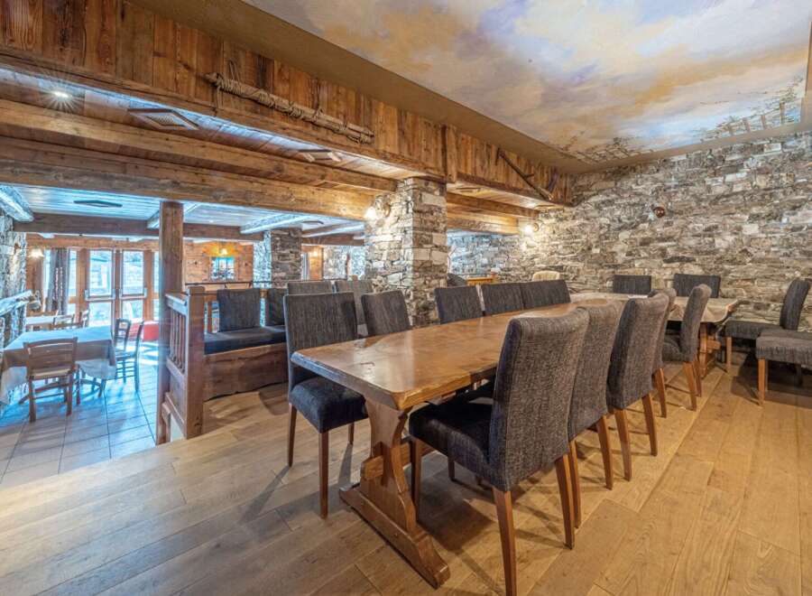 Step into rustic elegance with this stunning dining area.