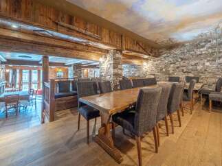 Step into rustic elegance with this stunning dining area.