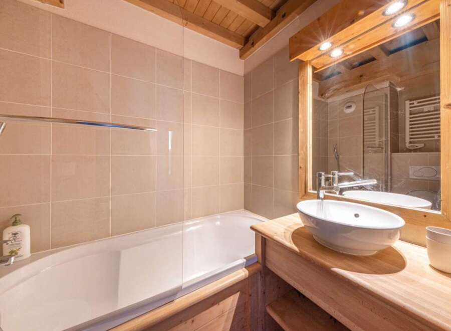 This charming bathroom features a sleek design with a modern touch.