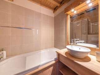 This charming bathroom features a sleek design with a modern touch.