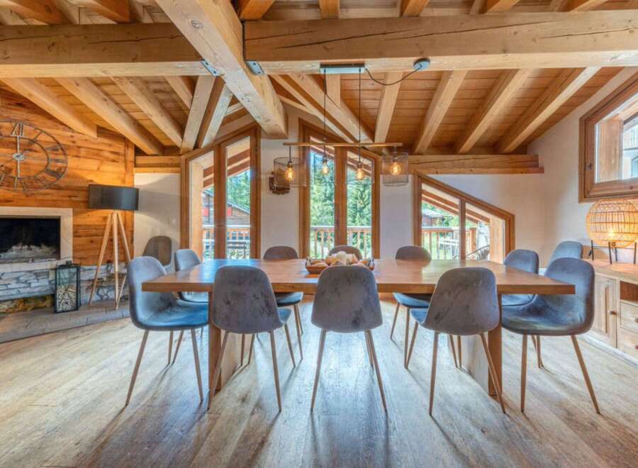 Experience the epitome of luxury living in this stunning property, featuring a spacious dining area perfect for hosting gatherings.