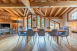 Experience the epitome of luxury living in this stunning property, featuring a spacious dining area perfect for hosting gatherings.
