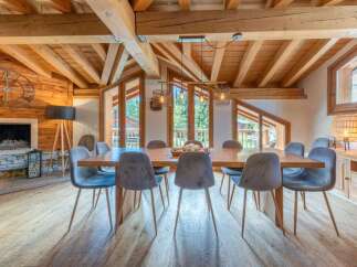 Experience the epitome of luxury living in this stunning property, featuring a spacious dining area perfect for hosting gatherings.