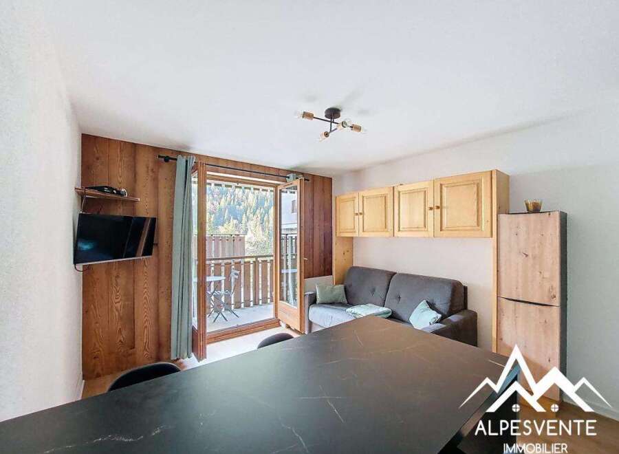 Discover a cozy living space with a balcony offering stunning views.