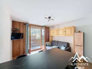 Discover a cozy living space with a balcony offering stunning views.