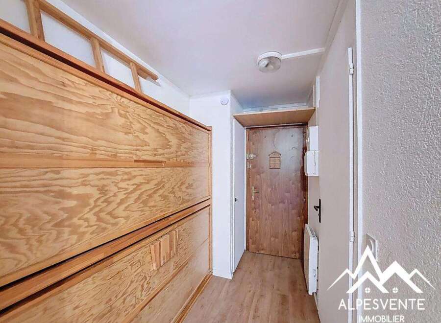 Discover this charming property featuring a well-designed interior with wooden elements.