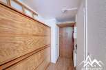 Discover this charming property featuring a well-designed interior with wooden elements.