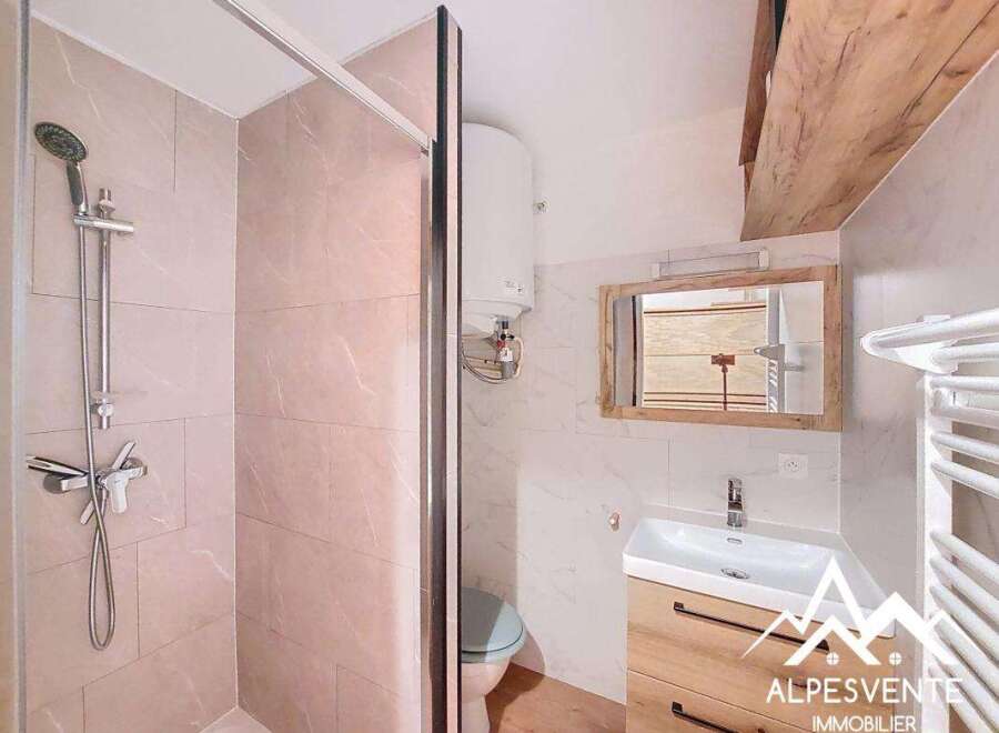 Discover this charming bathroom featuring a modern shower and stylish vanity.
