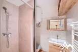 Discover this charming bathroom featuring a modern shower and stylish vanity.