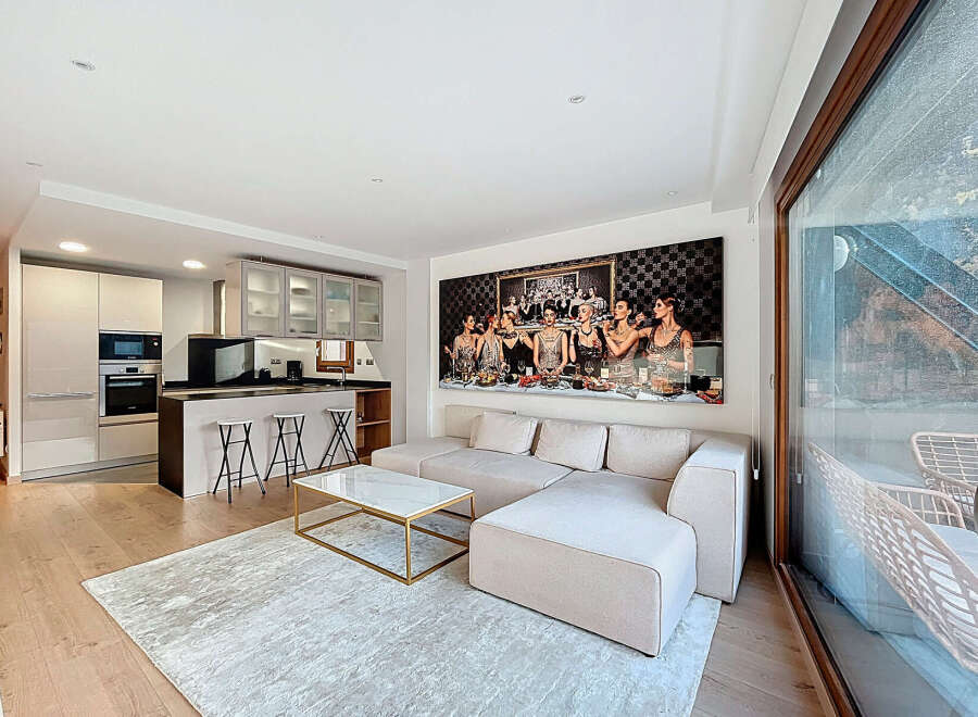 Experience luxury living in this stunning property featuring a modern open-plan kitchen and living area.