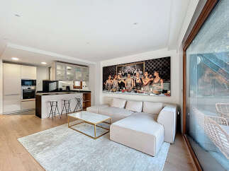 Experience luxury living in this stunning property featuring a modern open-plan kitchen and living area.