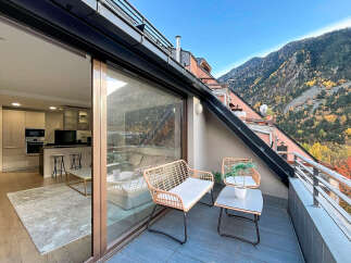 Experience luxury living with this stunning property featuring a spacious balcony and breathtaking mountain views.