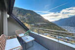 Enjoy breathtaking mountain views from this stunning balcony.
