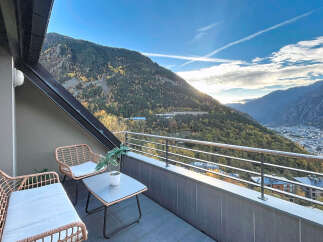 Enjoy breathtaking mountain views from this stunning balcony.