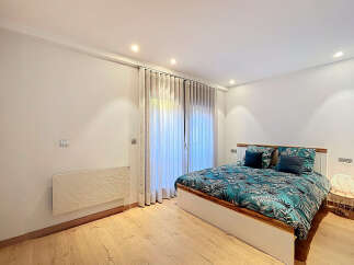 Discover the epitome of comfort and style in this stunning bedroom.