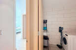 Discover the perfect blend of functionality and style in this modern laundry room.