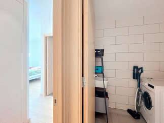 Discover the perfect blend of functionality and style in this modern laundry room.