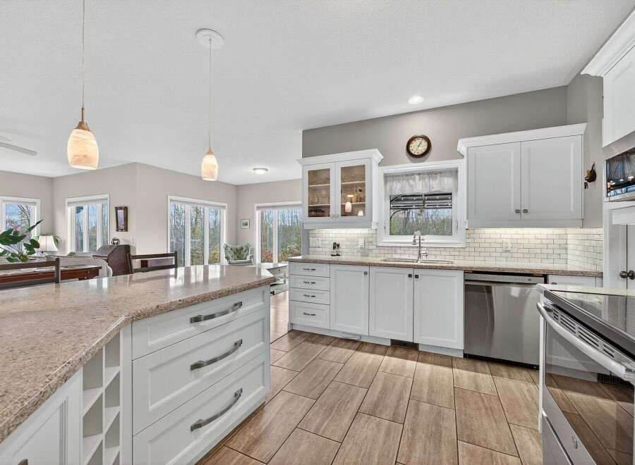 This stunning kitchen boasts a spacious layout with ample counter space, perfect for culinary enthusiasts.