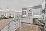 This stunning kitchen boasts a spacious layout with ample counter space, perfect for culinary enthusiasts.