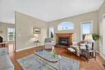 This stunning living room boasts a cozy fireplace, perfect for those chilly evenings.