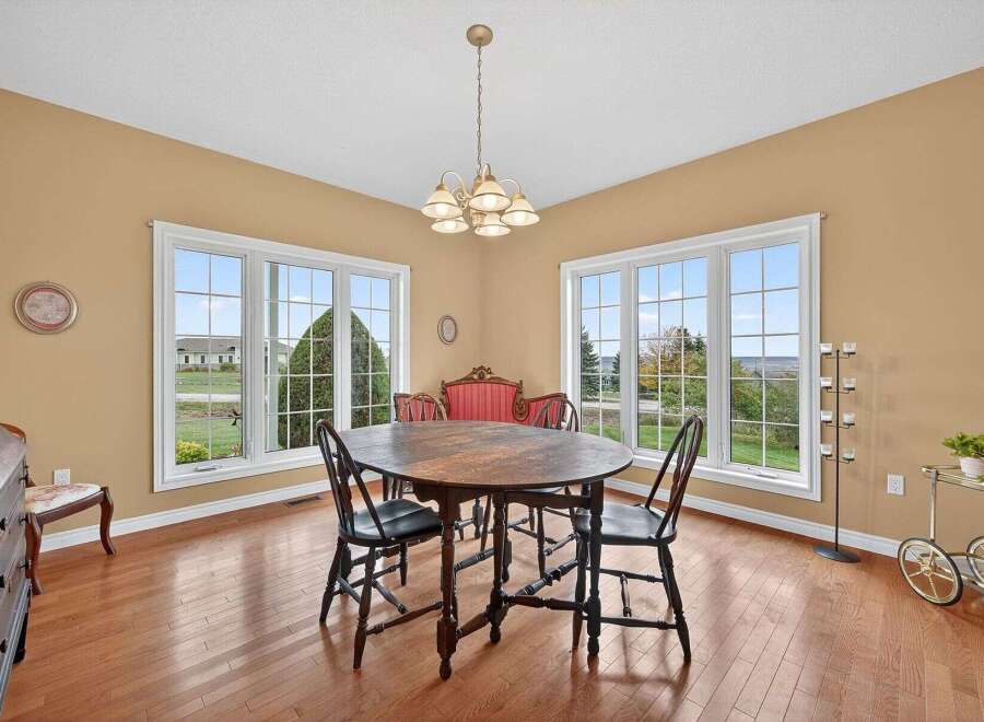 This elegant dining room features a classic oval table and chairs, perfect for hosting gatherings.