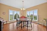 This elegant dining room features a classic oval table and chairs, perfect for hosting gatherings.