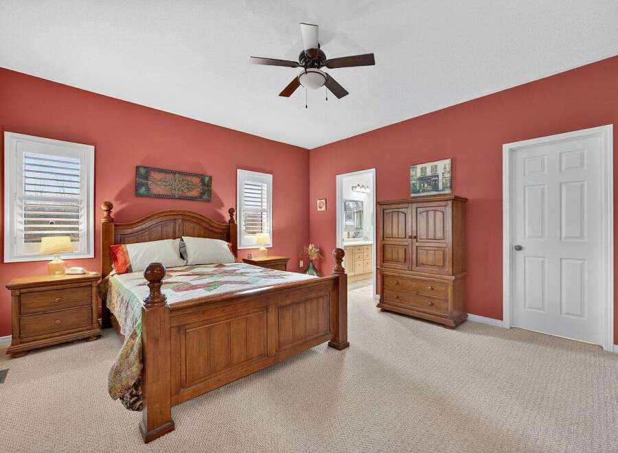 This inviting bedroom boasts a warm and cozy atmosphere, perfect for relaxation.