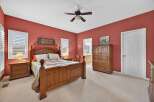 This inviting bedroom boasts a warm and cozy atmosphere, perfect for relaxation.