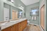 This inviting bathroom showcases a double vanity with ample storage, perfect for a shared space.