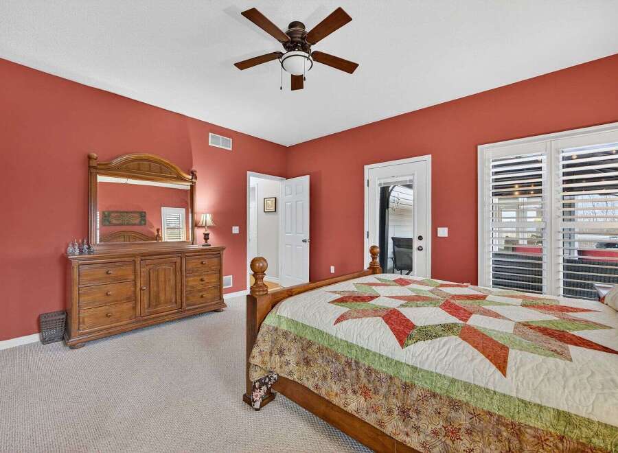 This inviting bedroom boasts a warm and inviting atmosphere, perfect for relaxation.