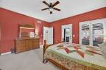 This inviting bedroom boasts a warm and inviting atmosphere, perfect for relaxation.