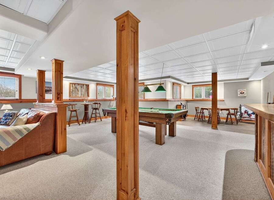 This stunning property boasts a spacious game room, perfect for entertaining guests.