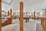 This stunning property boasts a spacious game room, perfect for entertaining guests.