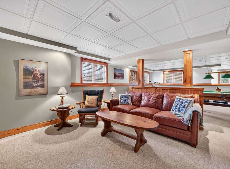 This cozy living space features a comfortable leather sofa, perfect for relaxing.