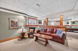 This cozy living space features a comfortable leather sofa, perfect for relaxing.
