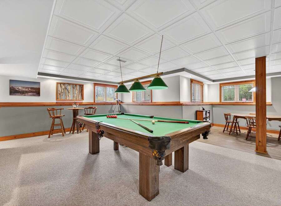 This stunning property features a spacious game room, perfect for entertaining.