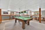 This stunning property features a spacious game room, perfect for entertaining.