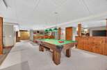 This stunning property boasts a luxurious game room, perfect for entertaining guests.