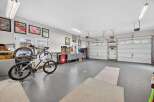 This spacious garage offers ample room for vehicles, storage, and hobbies.